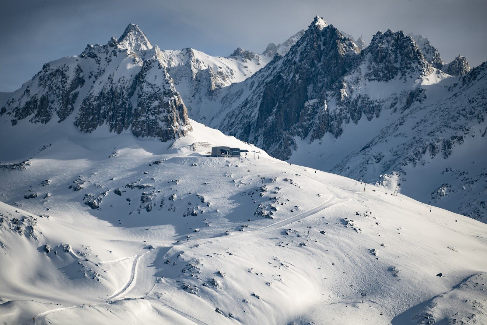 The Gemsstock rising above the reborn village of Andermatt in winter