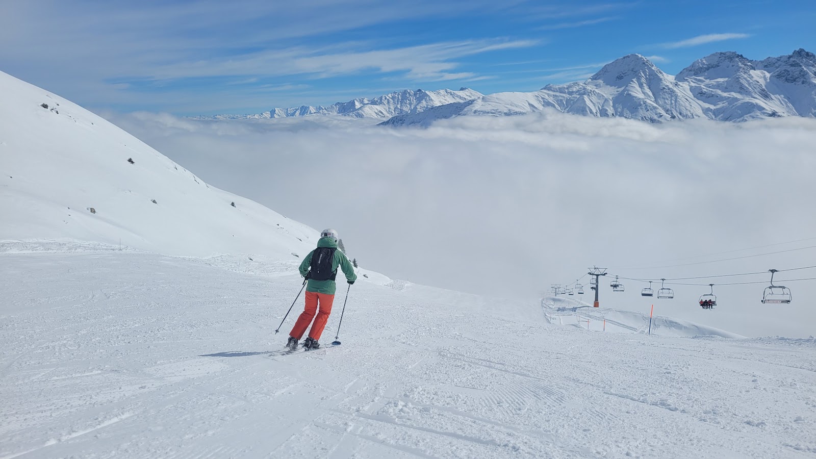 Skiers descending the steep Gemsstock off piste at Andermatt