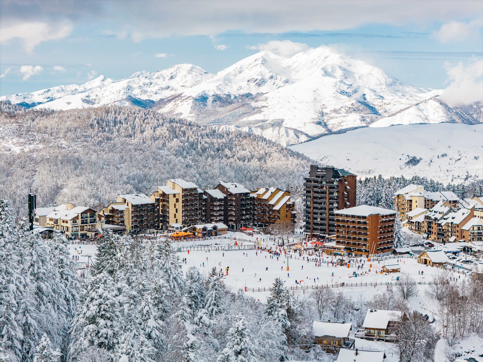 The forested and open slopes of Ax 3 Domaines above the spa town of Ax les Thermes in the Ariege Pyrenees