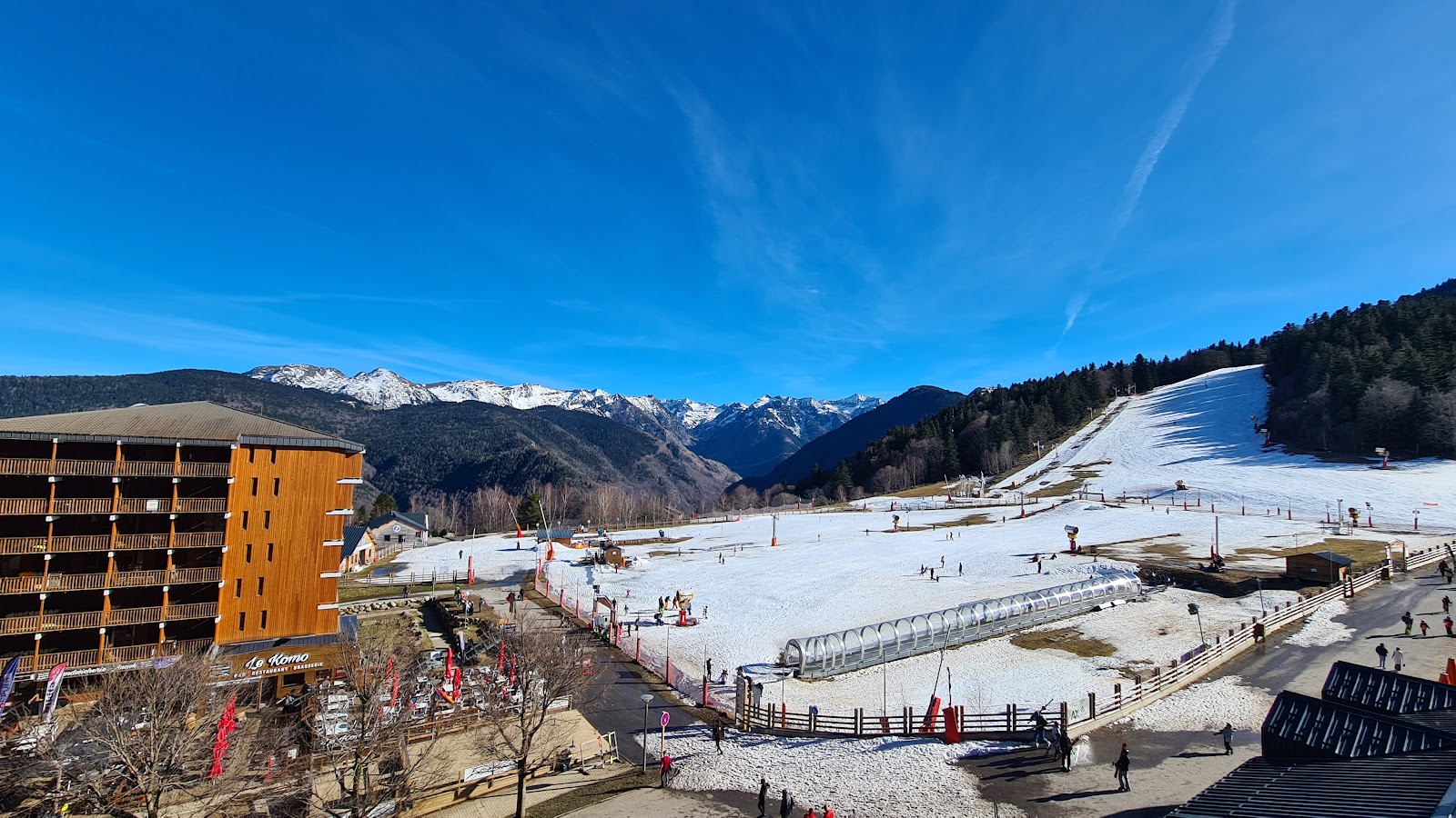 Forested pistes and Ariege peaks at Ax 3 Domaines