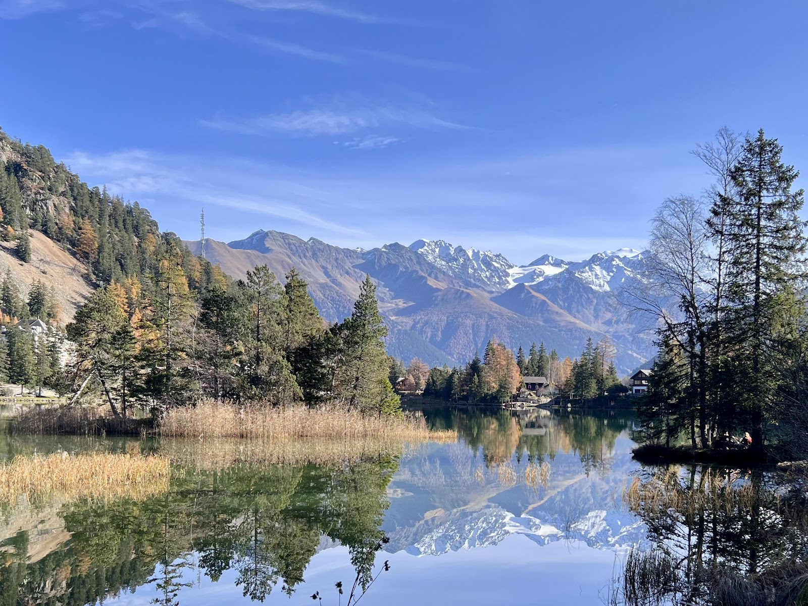 Snow covered chalets along the lakeside in Champex Lac