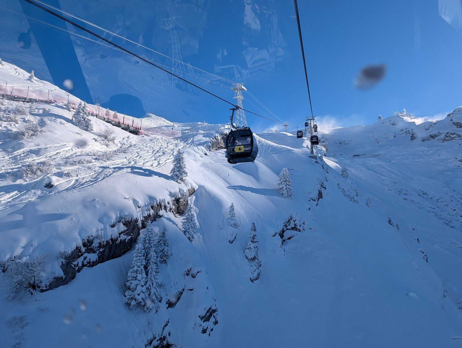 The Engelberg valley village with its monastery and snowy peaks
