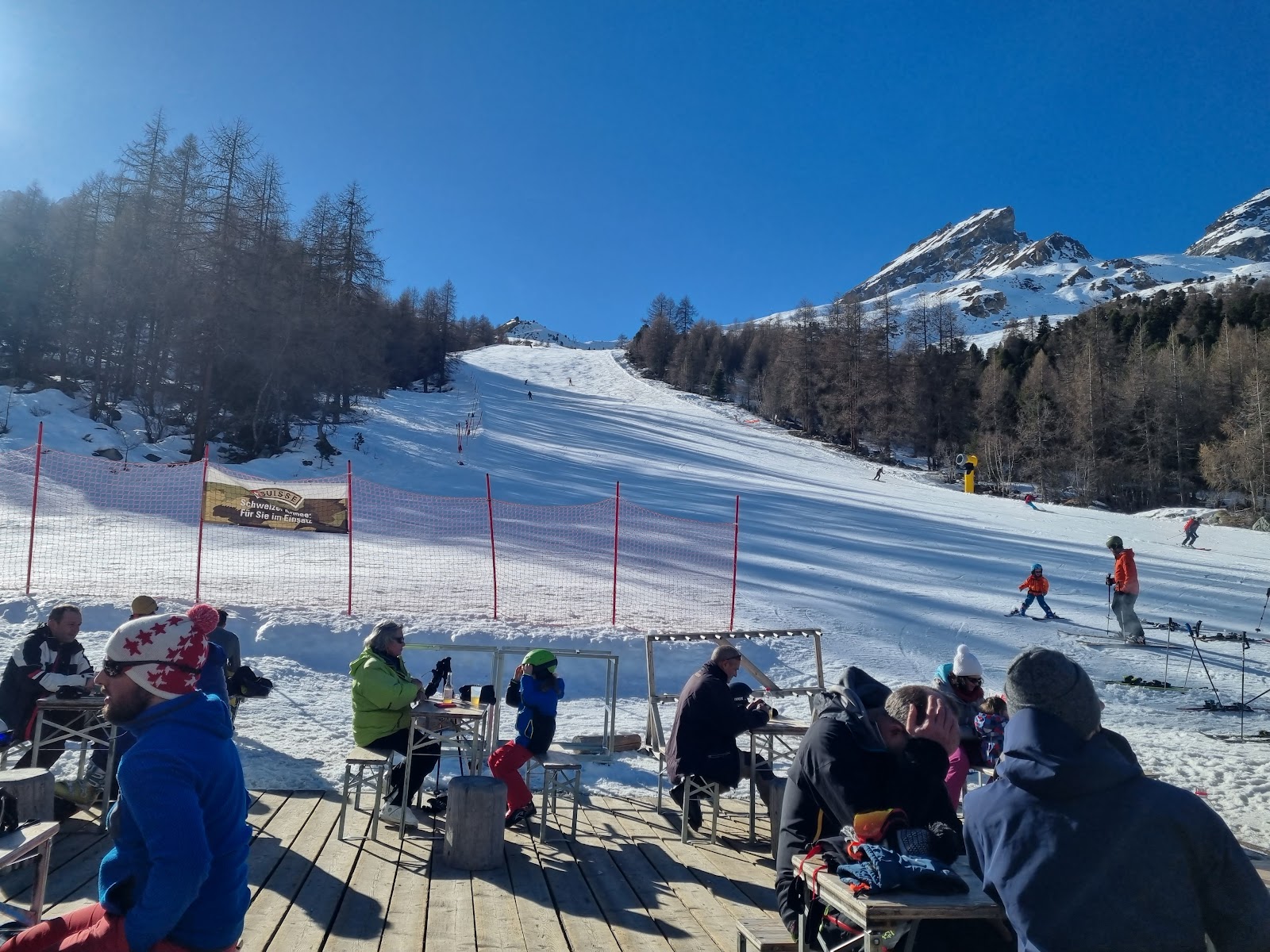 Sunny gentle pistes above Evolene with sweeping Valais mountain views
