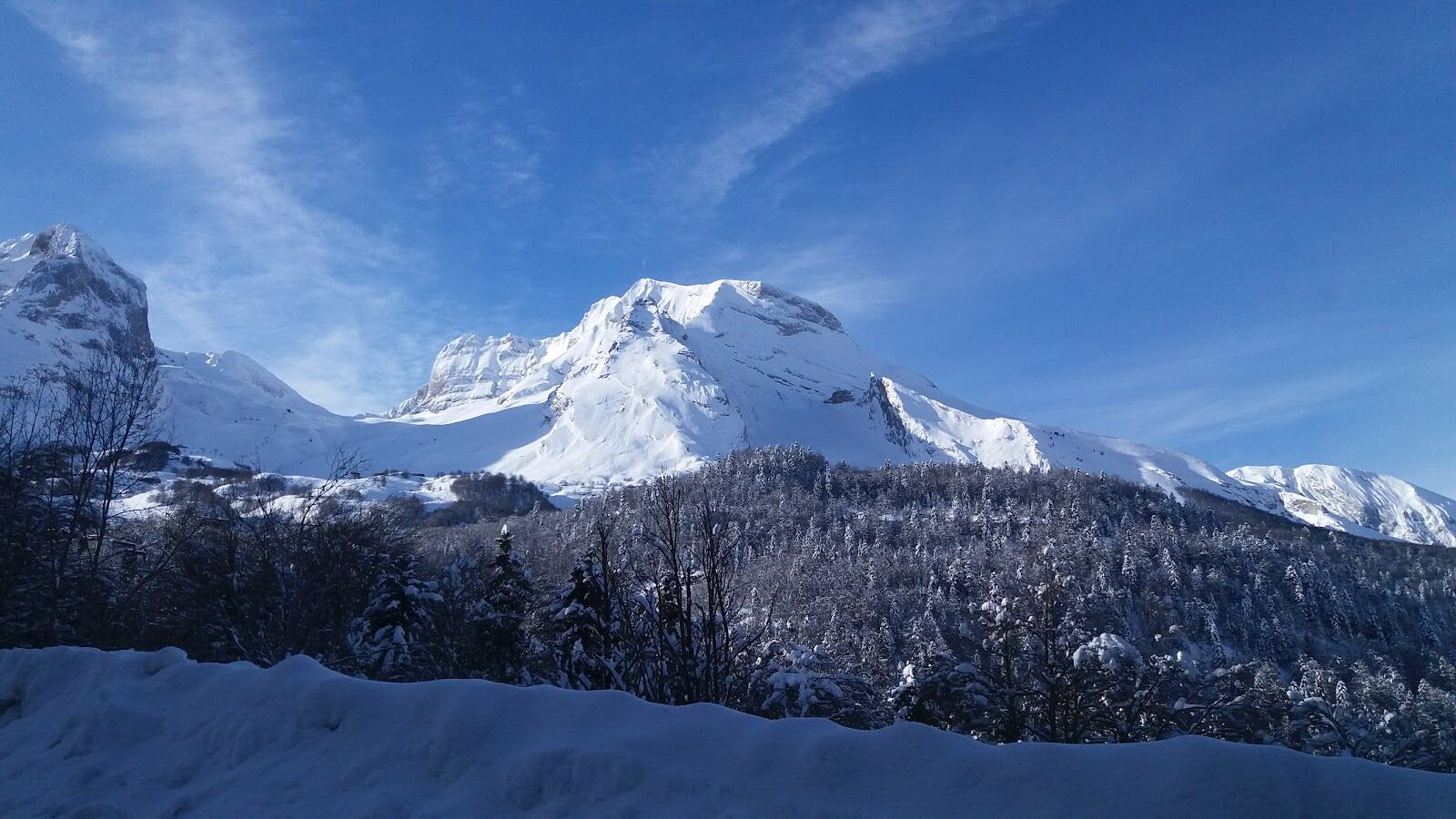 The upper slopes and peaks above Gourette under deep snow