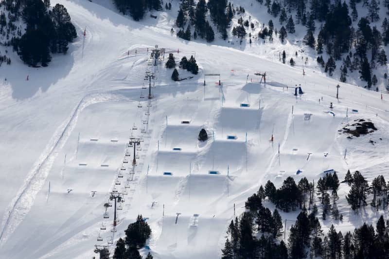 Tree lined pistes dropping into the El Tarter sector of Grandvalira in Andorra