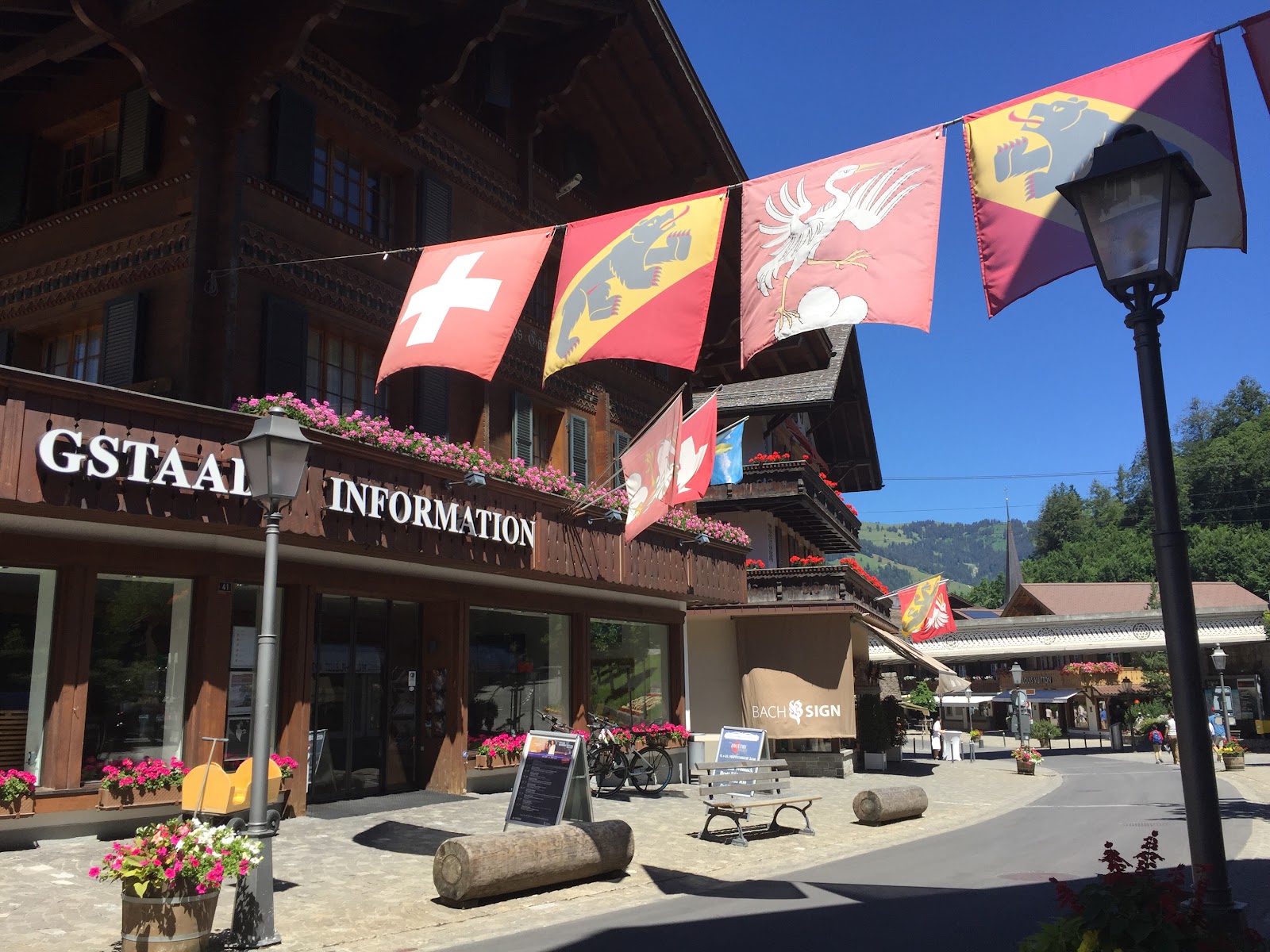 Traditional timber chalets lining a snowy street in Gstaad