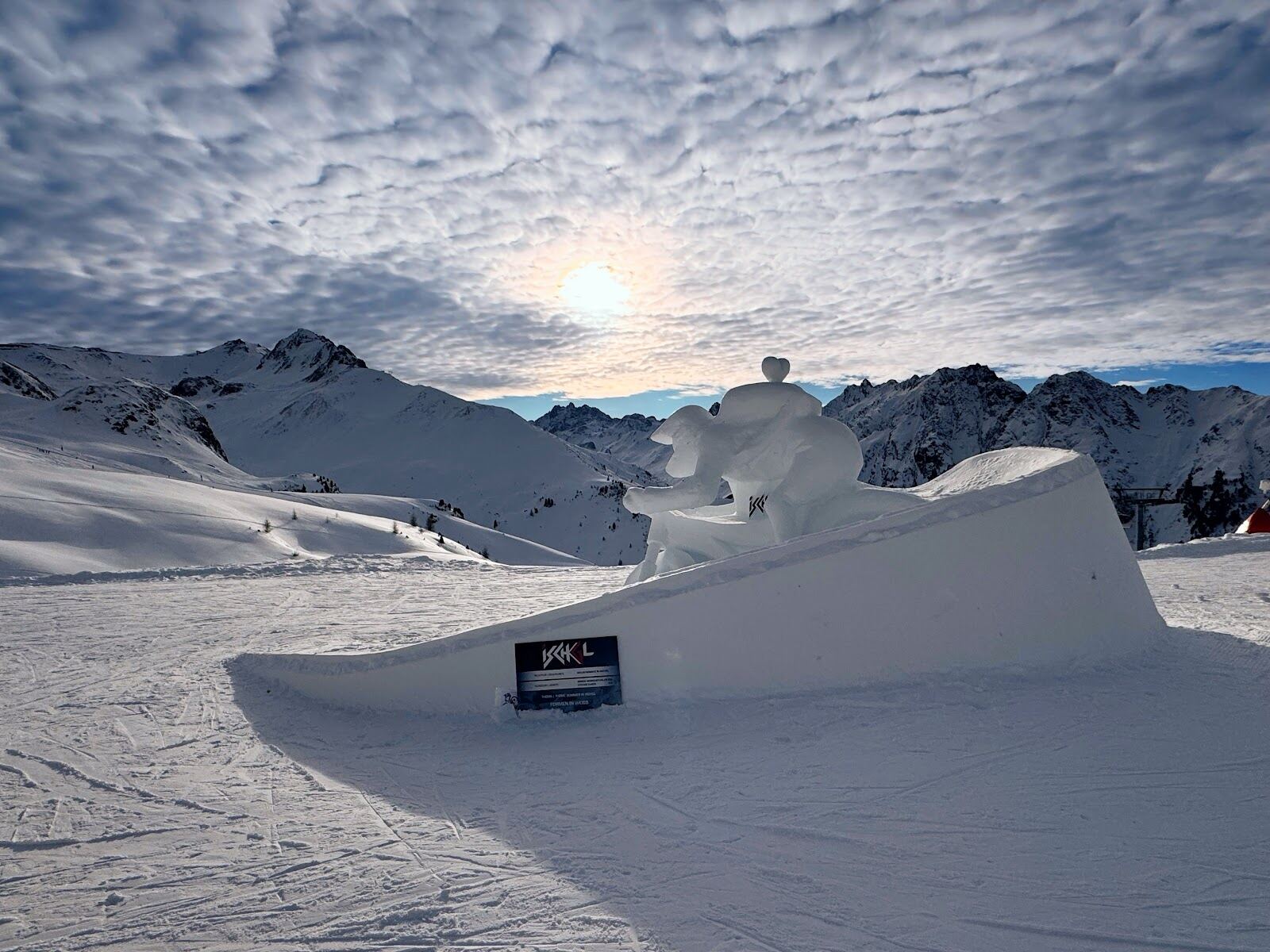 The high snowy ski area above Ischgl under a blue Tyrolean sky