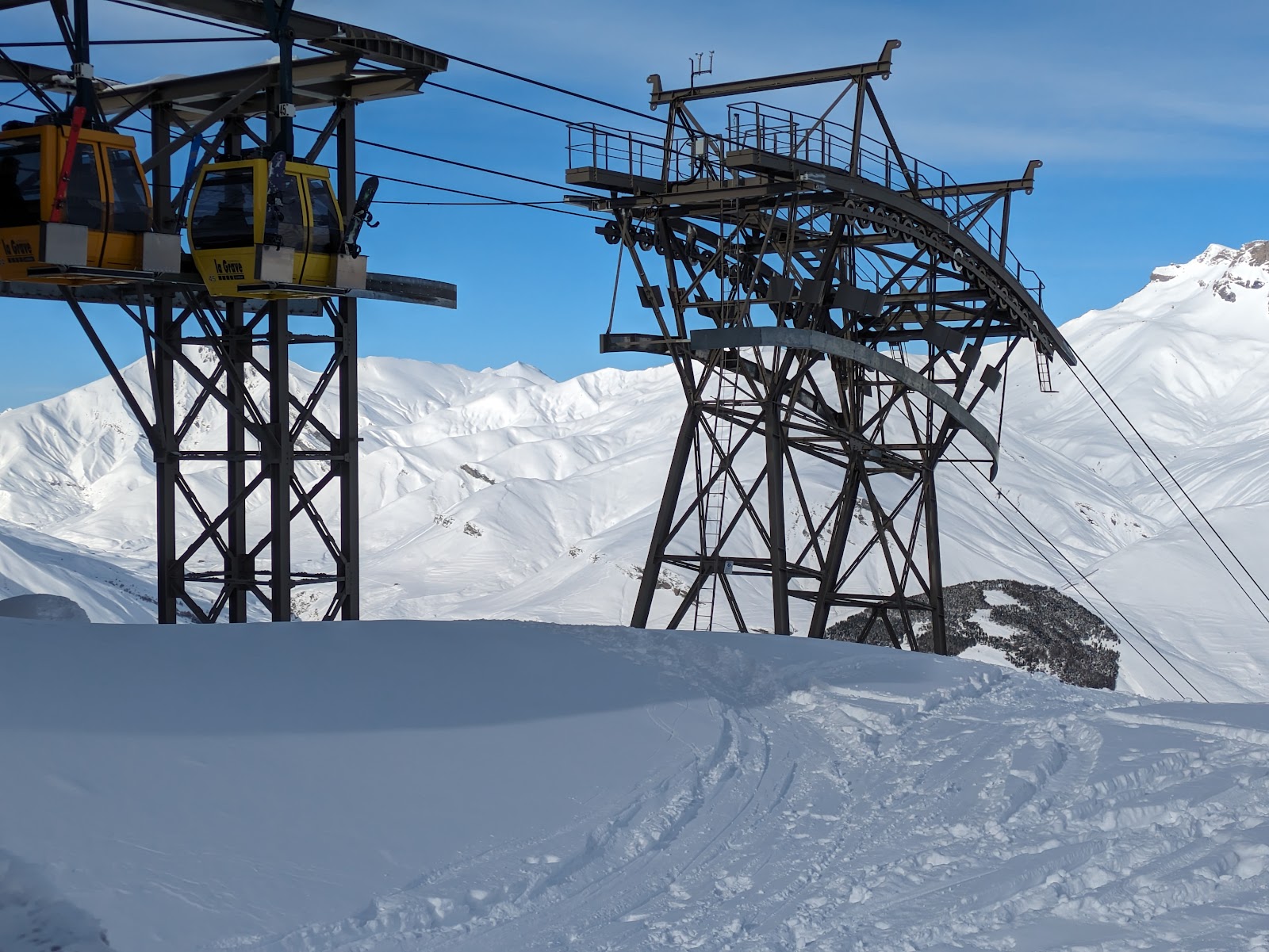 Steep ungroomed couloir and powder slopes beneath La Meije