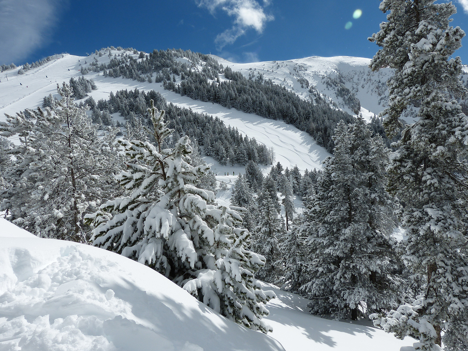 Sunny Catalan Pyrenees pistes above the La Molina base