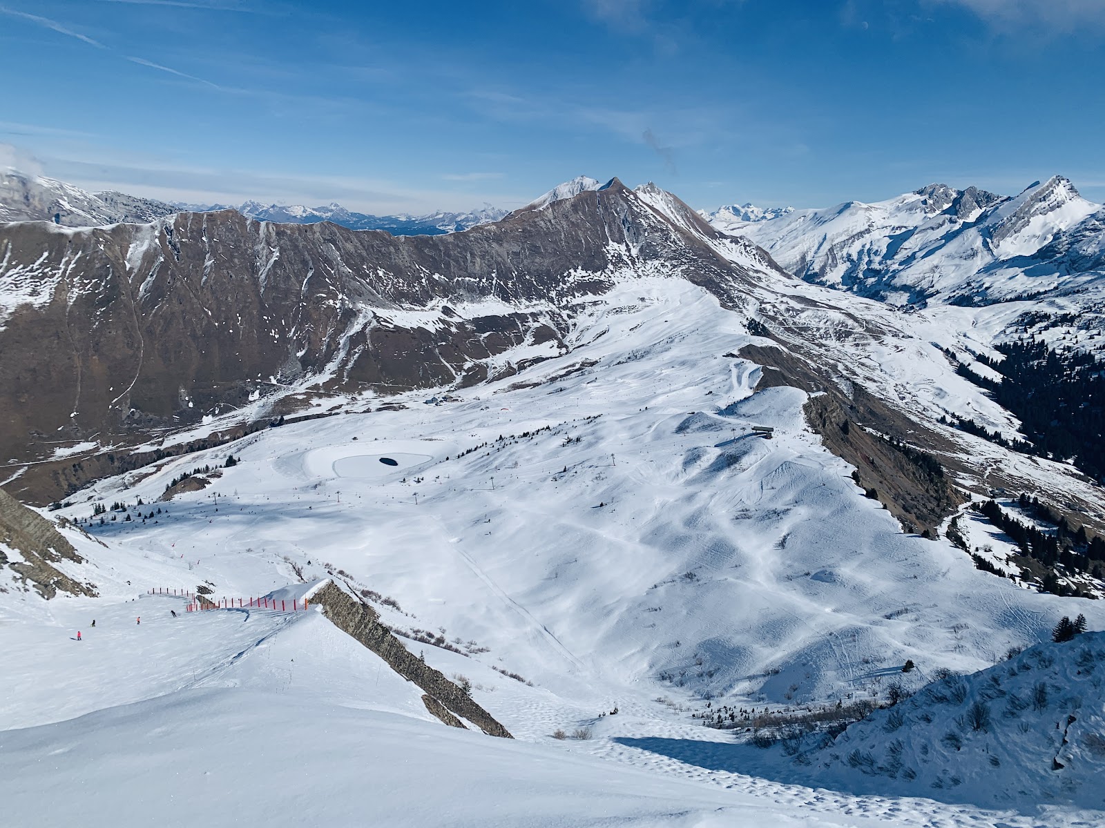 Snowy pistes and lifts above Le Grand Bornand in the Aravis