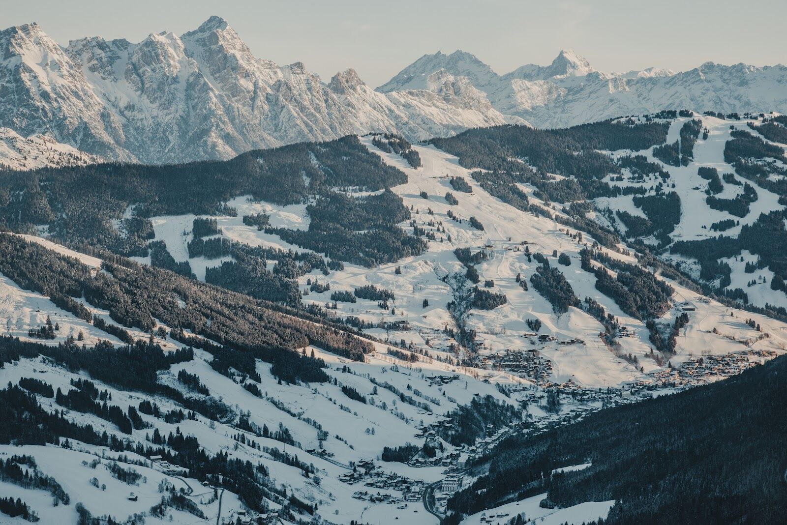 Modern gondola rising from the Leogang valley in winter