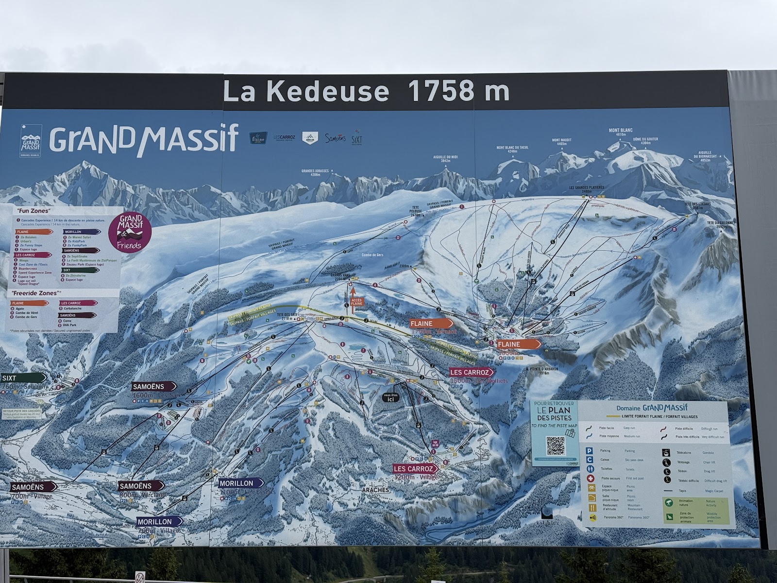 The sunny village center of Les Carroz with the slopes above