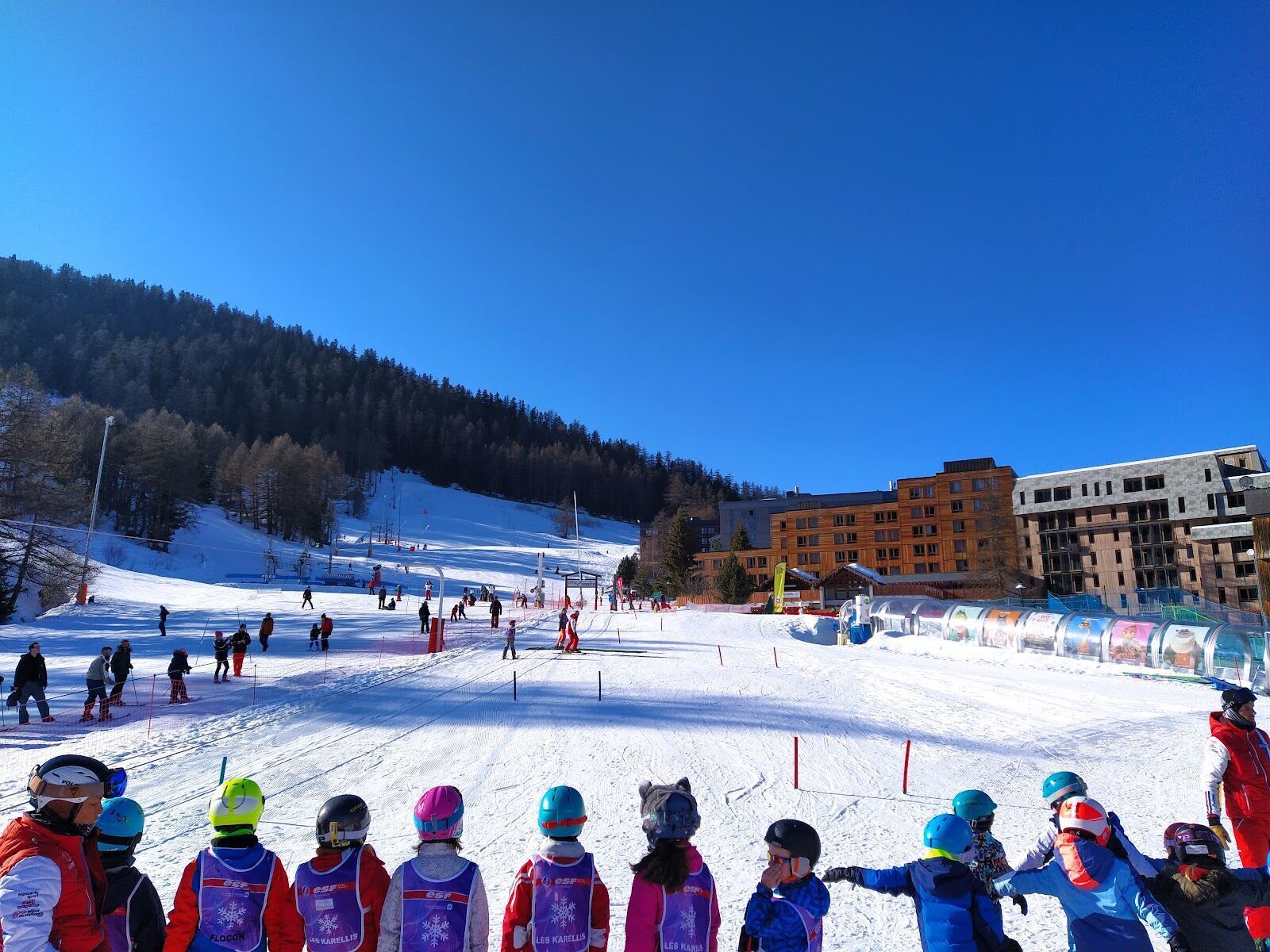 Children and families on a gentle beginner slope