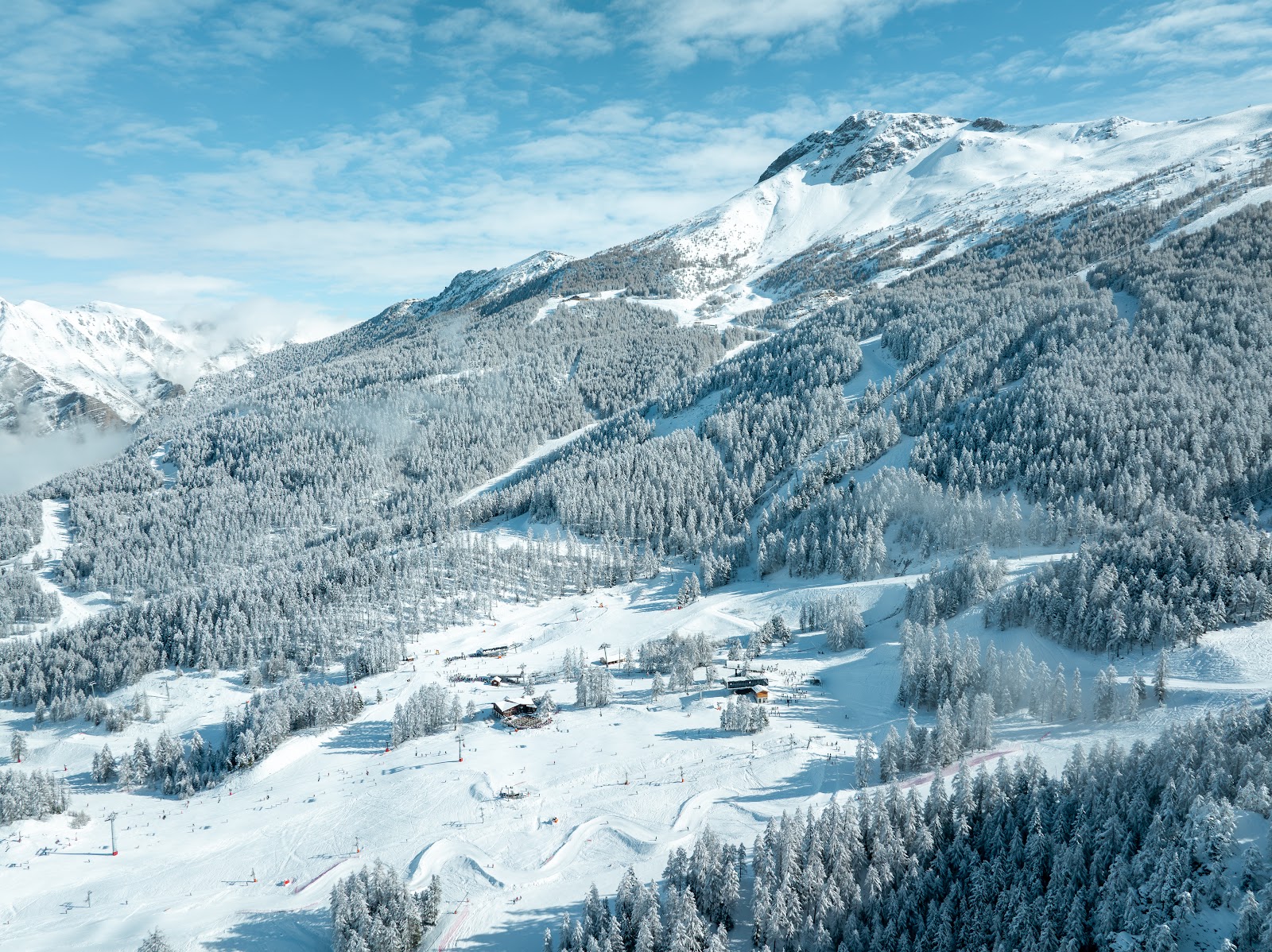 Larch lined pistes at Les Orres above the Serre Poncon lake