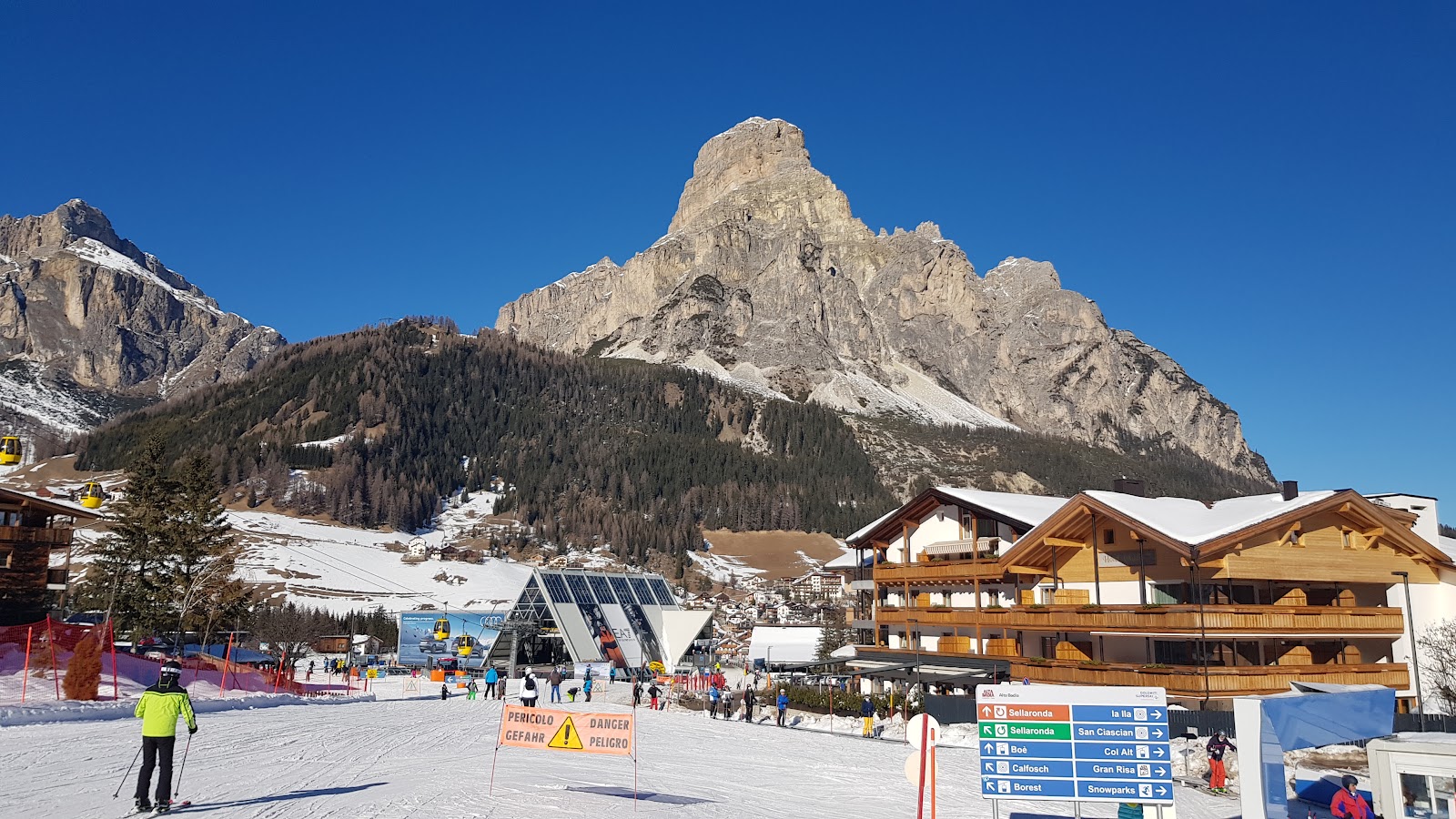The elegant village of San Cassiano in Alta Badia below the Dolomite peaks