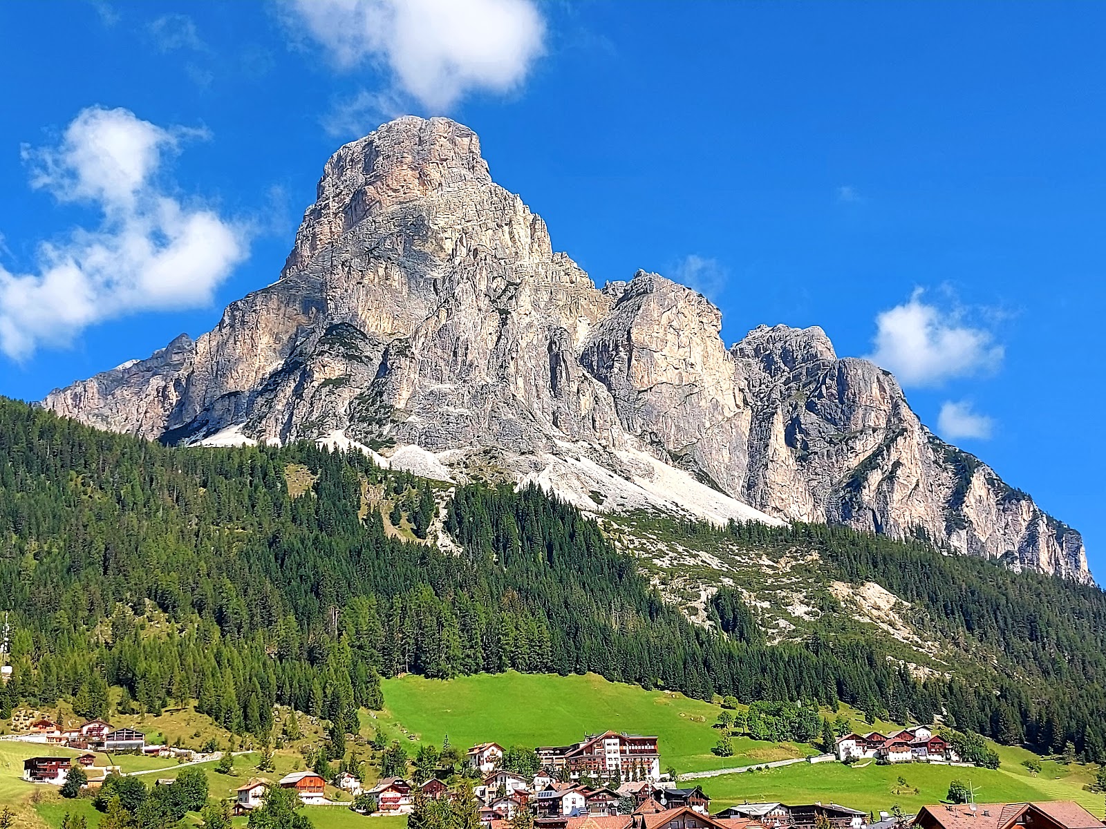 Immaculately groomed Alta Badia pistes above San Cassiano in winter sun