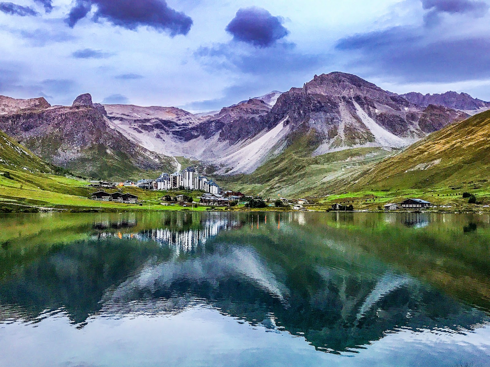 A high purpose built French ski resort beside a frozen lake