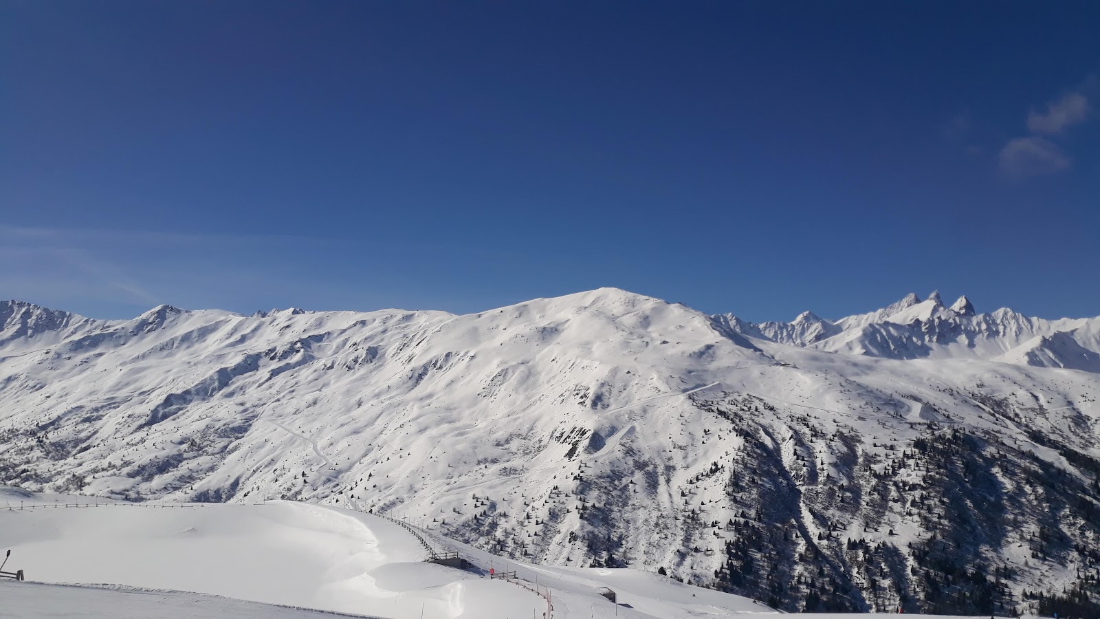 Sunny groomed pistes above the village of Valloire