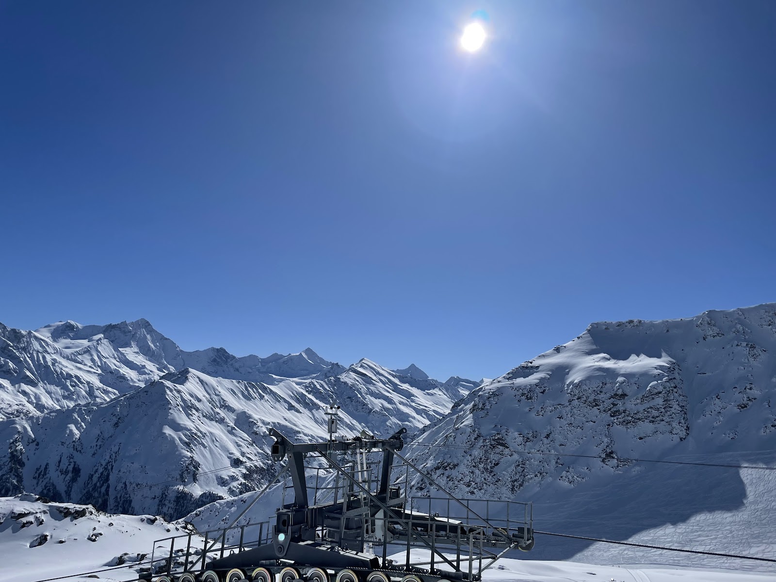 Skier on a high north facing piste above the Val d'Anniviers
